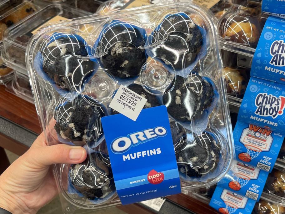 Hand holding a pack of Oreo Two-Bite Muffins 