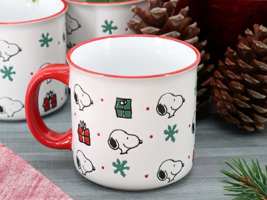 Peanuts Snoopy Christmas Gift 4-Piece 21oz Stoneware Camper Mug Set on table