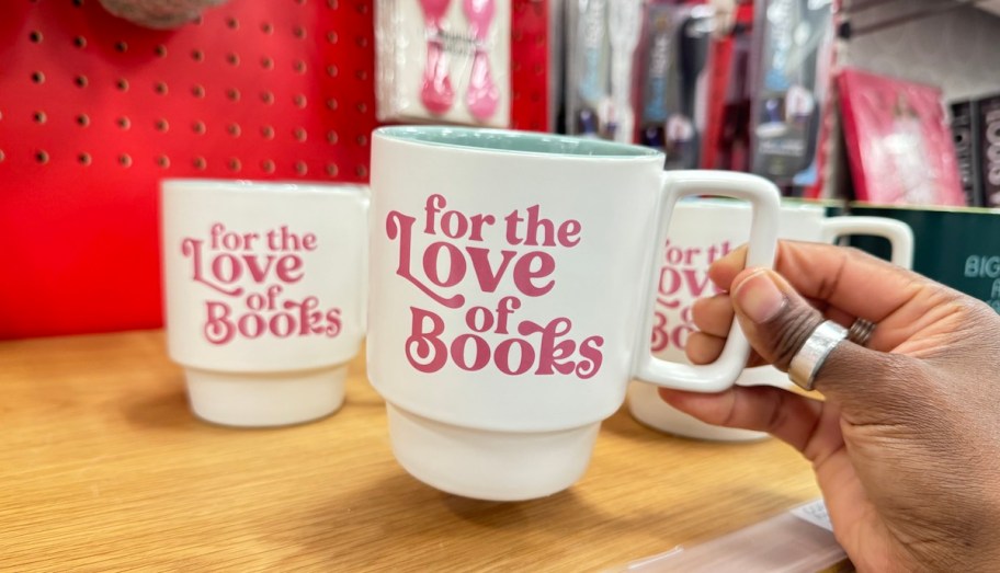 hand holding handle on for the love of books mug