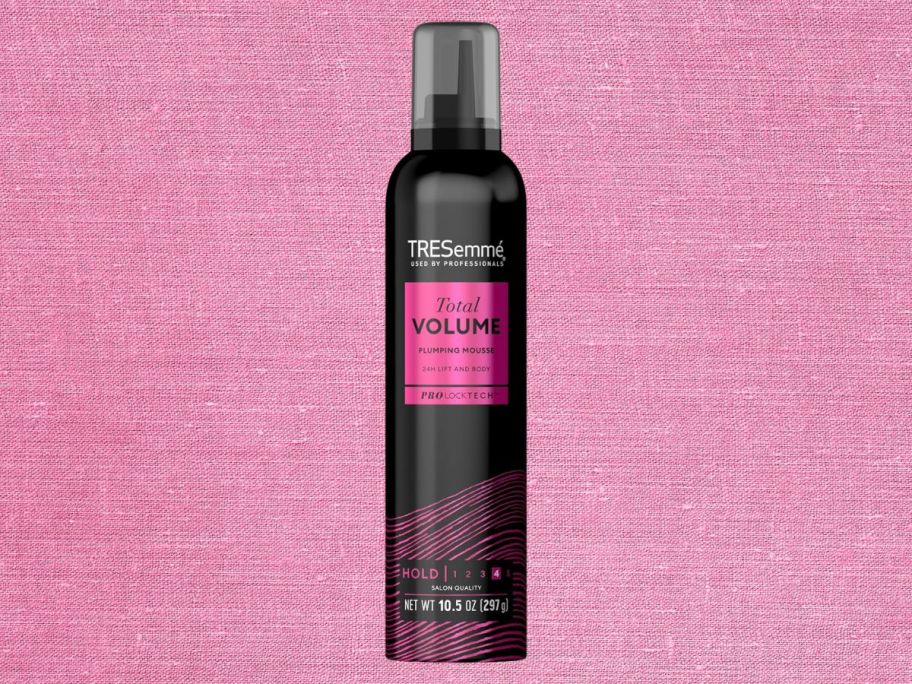 Tresemme Plumping Mousse Total Volume 10.5oz against pink background