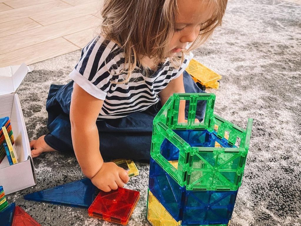 A little girl playing with Tytan Tiles