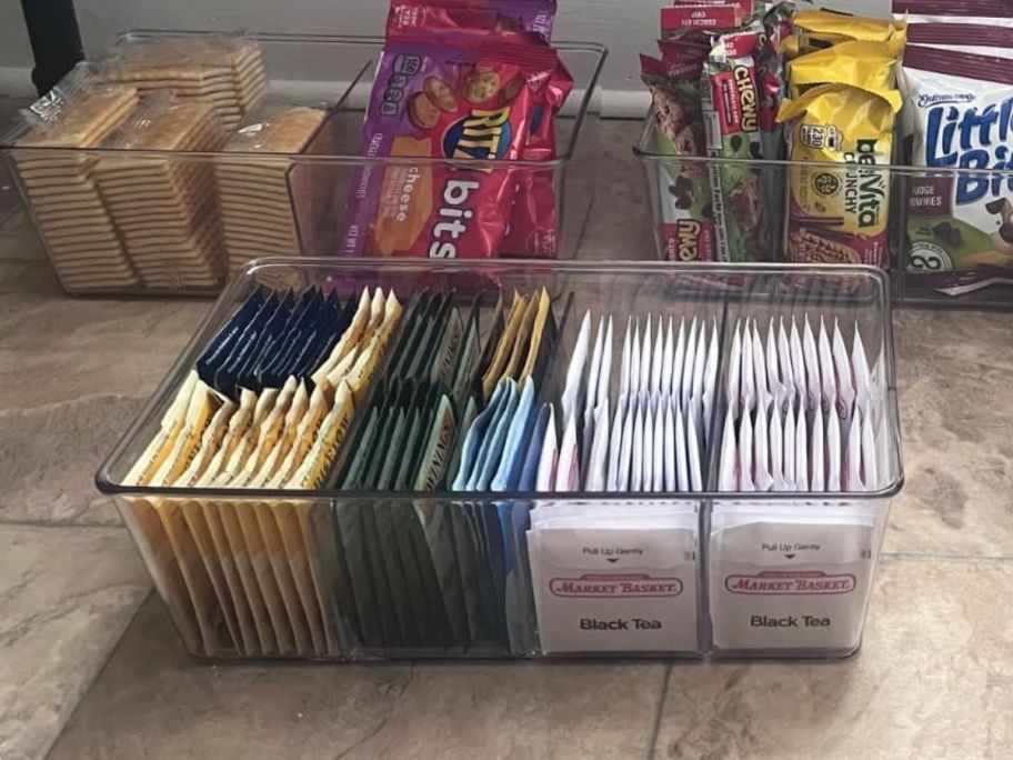 Clear Plastic Bins filled on the kitchen floor