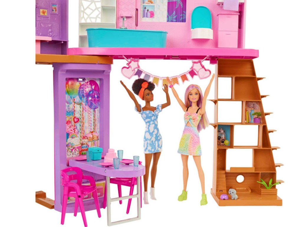 area of barbie vacation house with two dolls in it