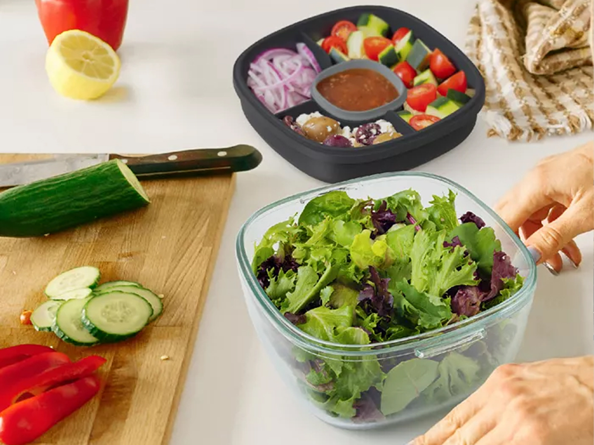 salad container on counter with veggies