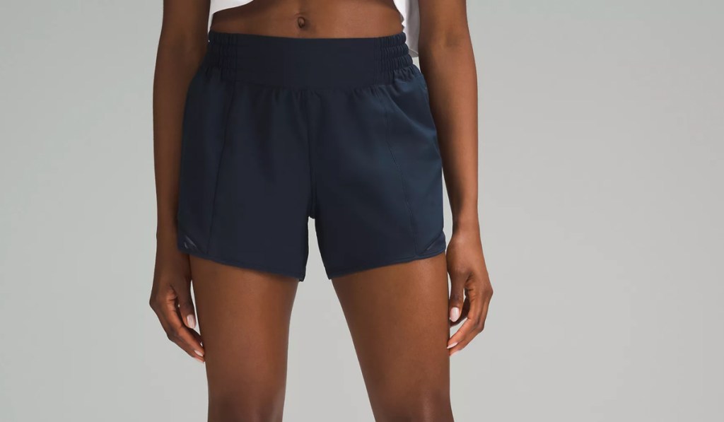 woman in navy blue lululemon shorts