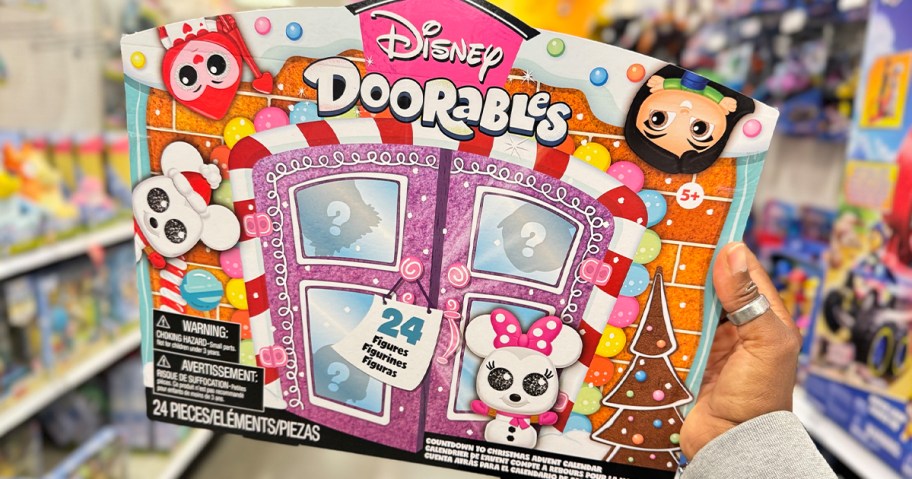 hand holding disney doorables advent calendar in target