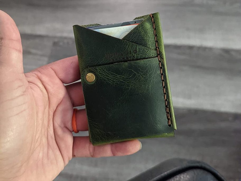 hand holding leather slim wallet