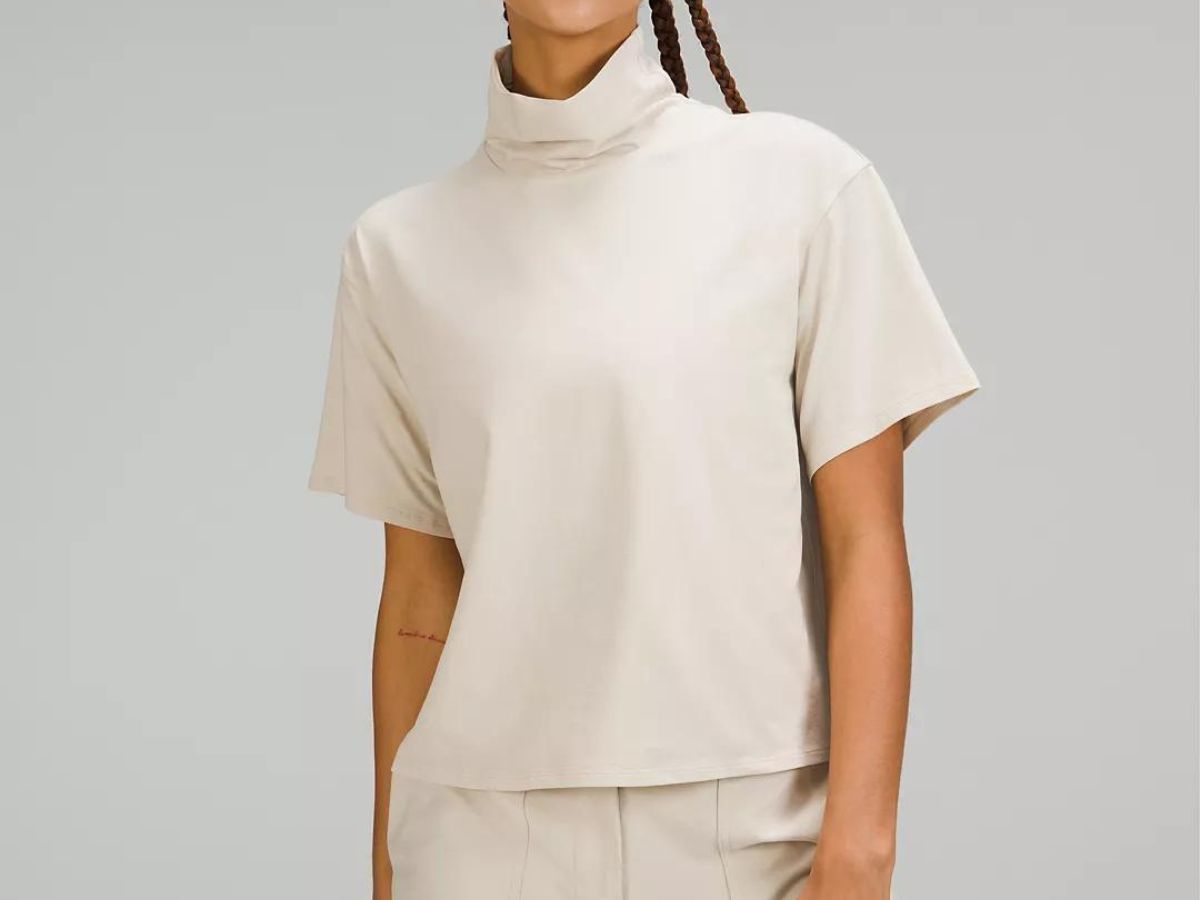 woman wearing beige turtleneck 