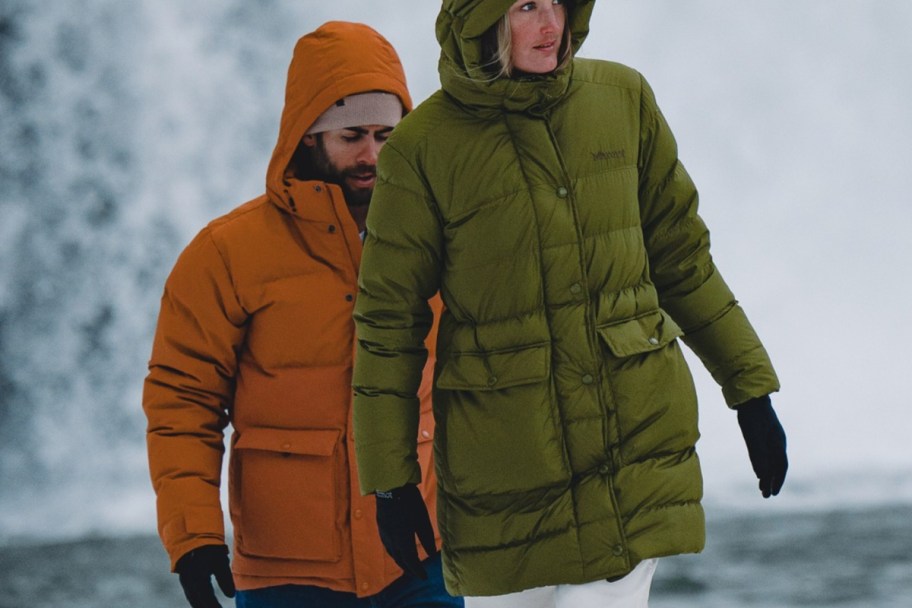 man and woman in puffer jackets