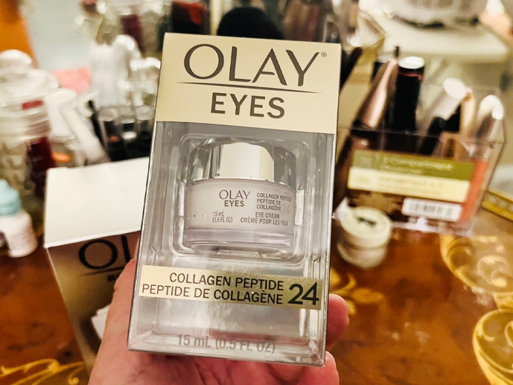 hand holding olay eyes collagen peptide jar