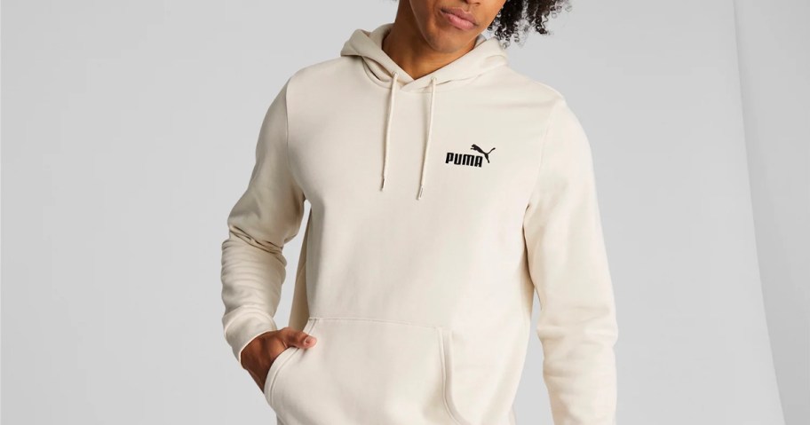 man wearing beige puma hoodie 