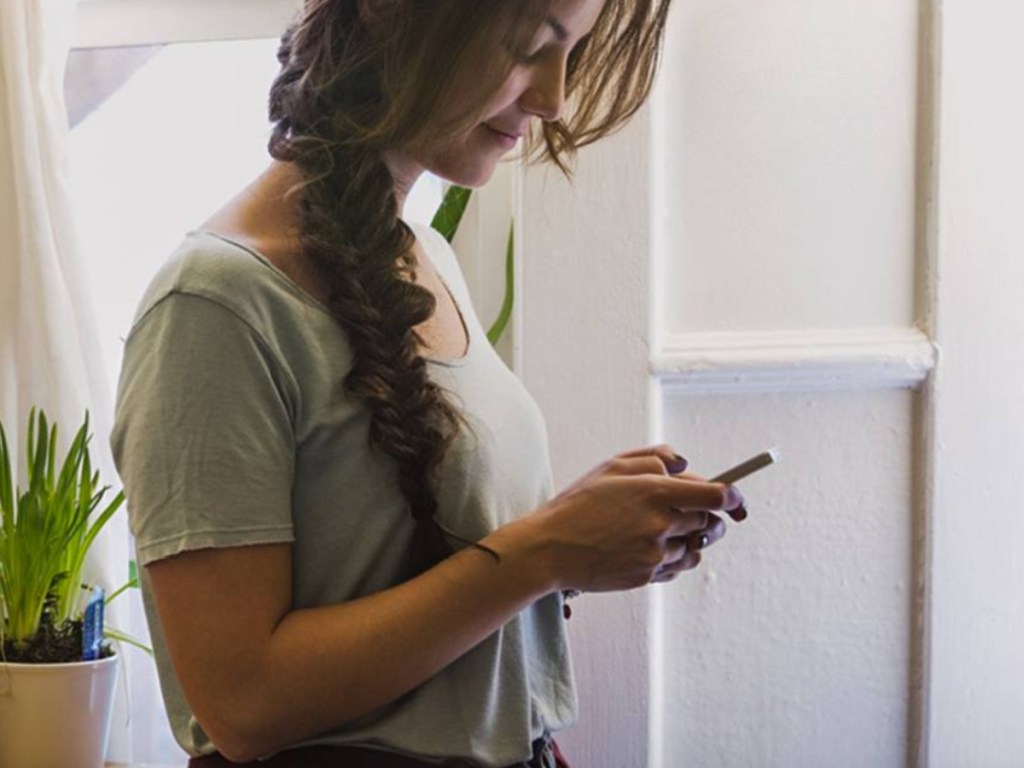 woman holding phone