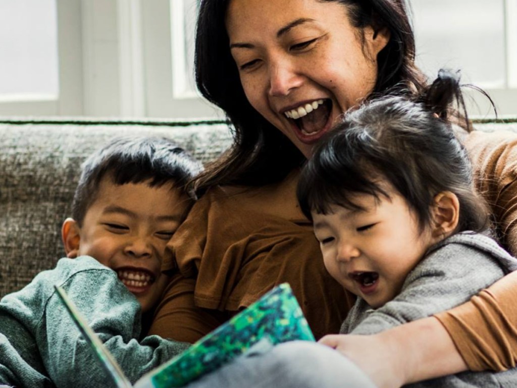 mom and kids sitting on couch