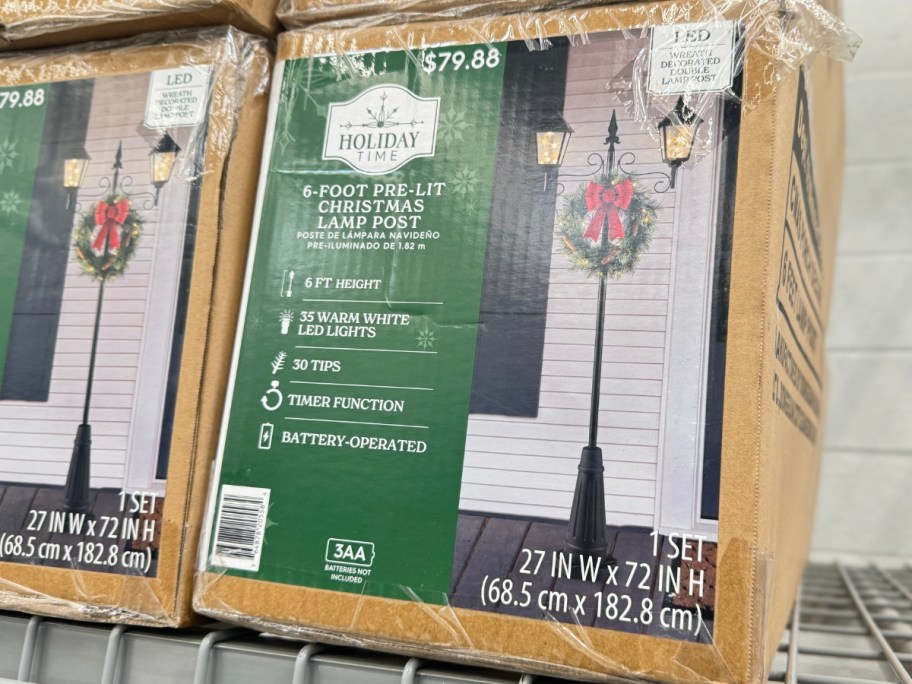 large Christmas lamp post decoration in a box on a store shelf