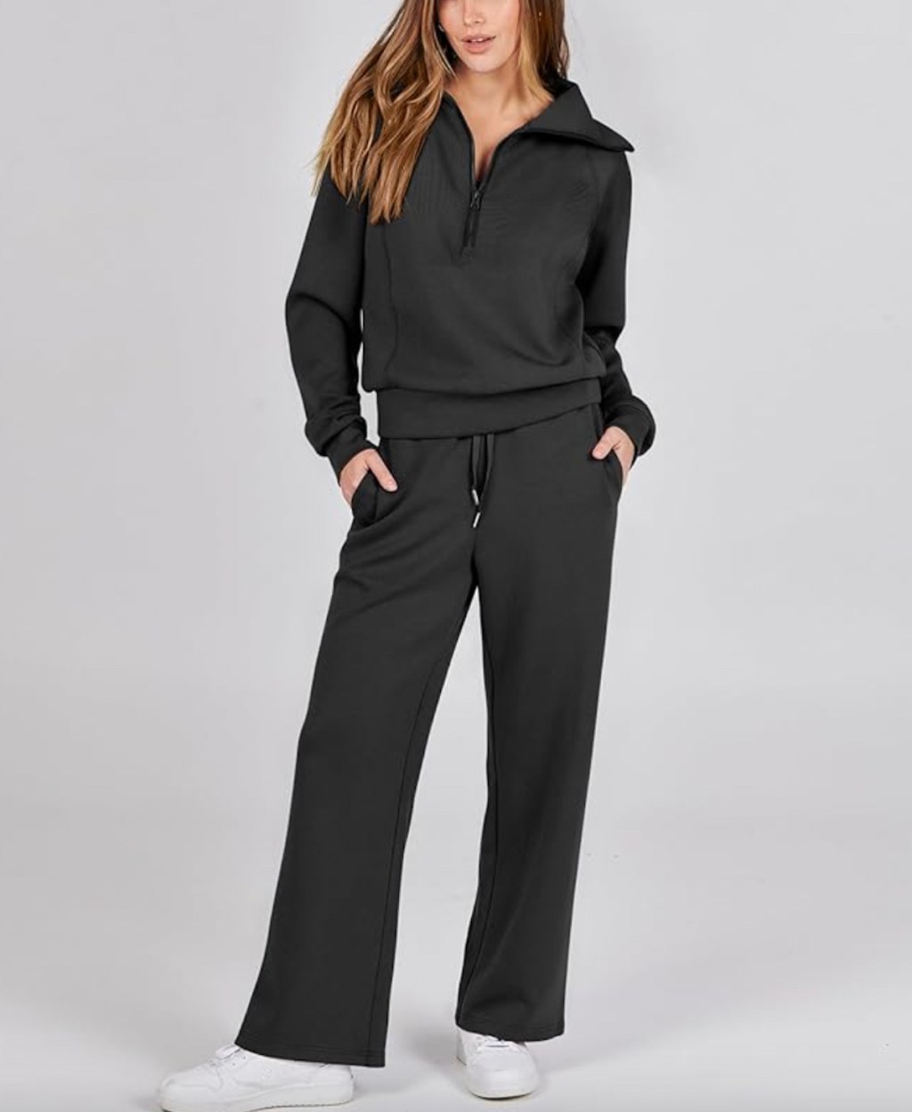 Stock photo of woman wearing black sweatsuit