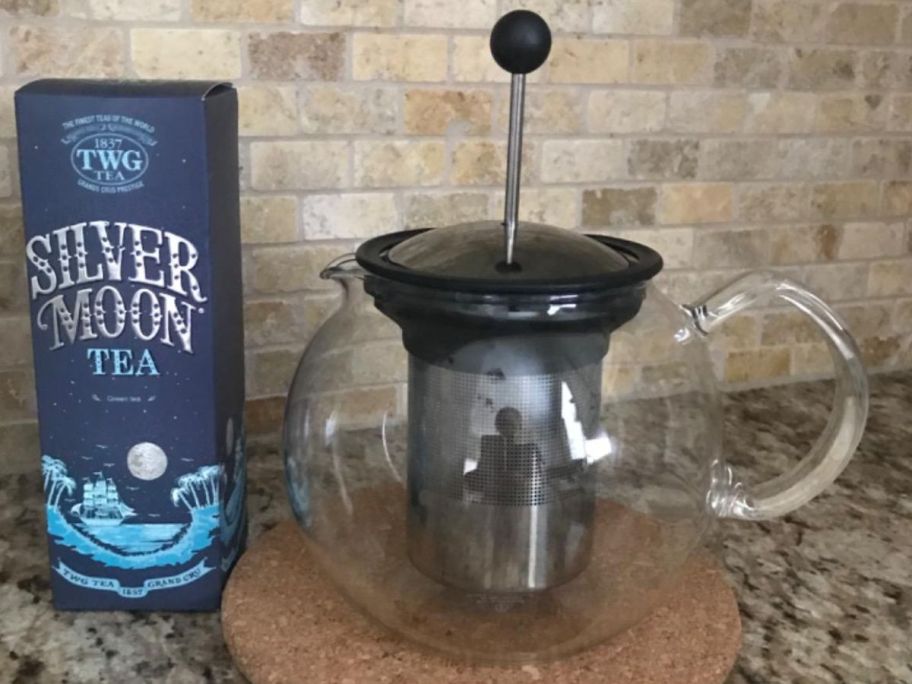 A Bodum Tea Press next to a box of tea