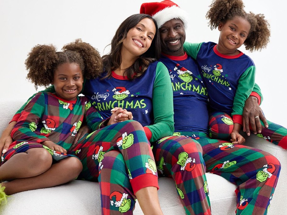 Family wearing Grinch matching Pjs