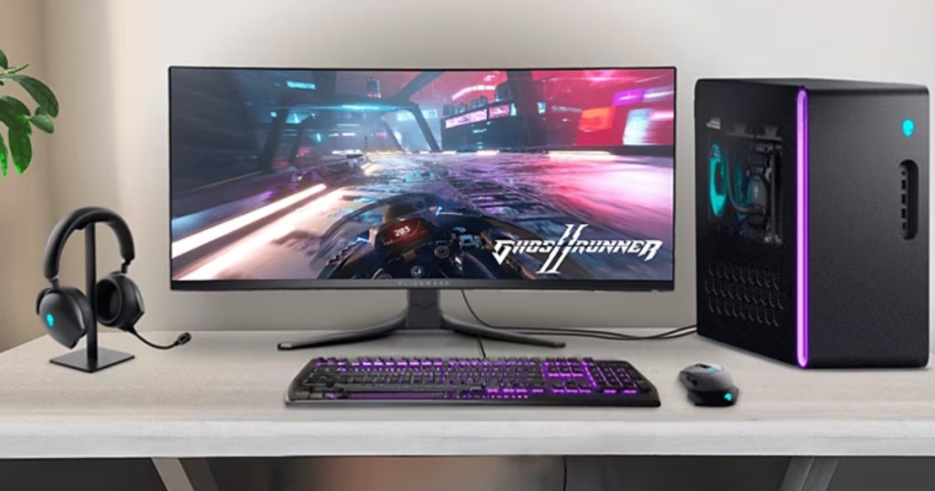 onlineputer on desk with ALIENWARE DUAL MODE WIRELESS GAMING HEADSET and mouse