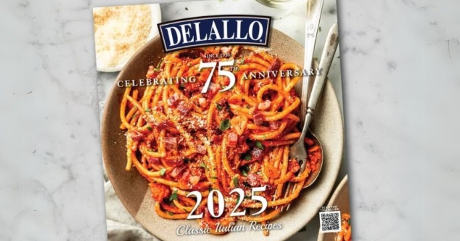 a DeLallo 2025 Recipe Calendar on a marble counter background, the calendar has a plate of pasta on the cover