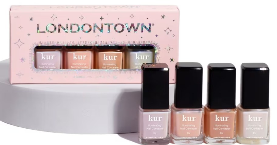 pink box of Londontown nail polish on a stand, 4 bottles of nail polish in lighter colors in front of it