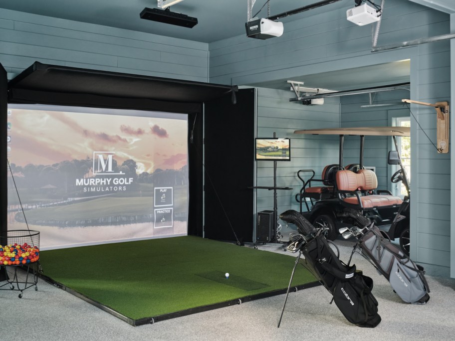 The HGTV Dream Home Garage with a golf swing practice area and golf cart storage