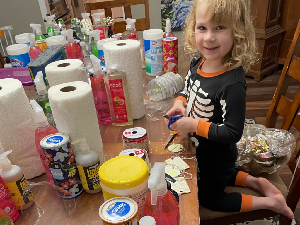 A little girl making a Christmas present