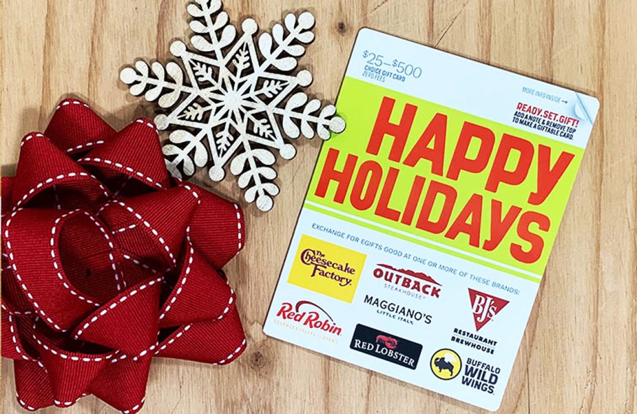 Happy Holidays Dining Gift Card near snowflake and gift bow