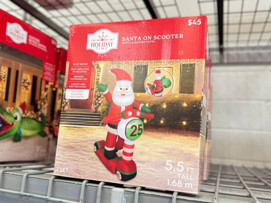 Holiday Time Inflatable Santa On Scooter on shelf in store