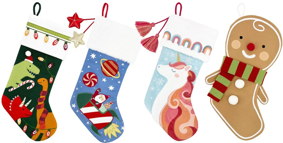 dinosaur, space santa, unicorn, and gingerbread man stockings