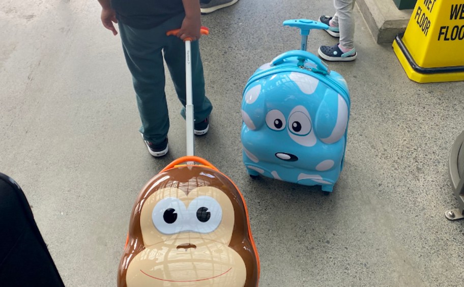 two kids luggage suitcases in monkey and dog shapes