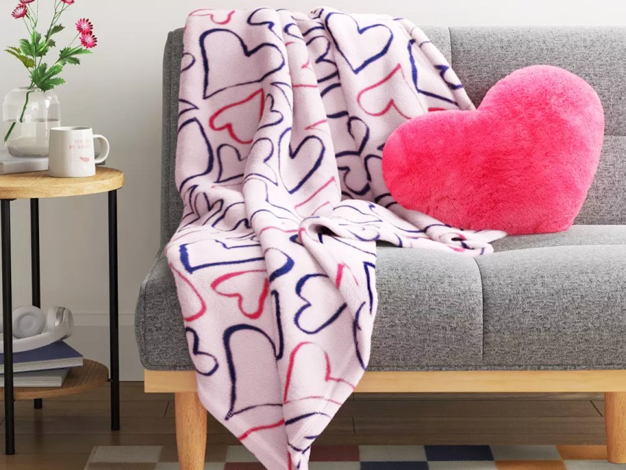 heart print throw blanket draped over couch