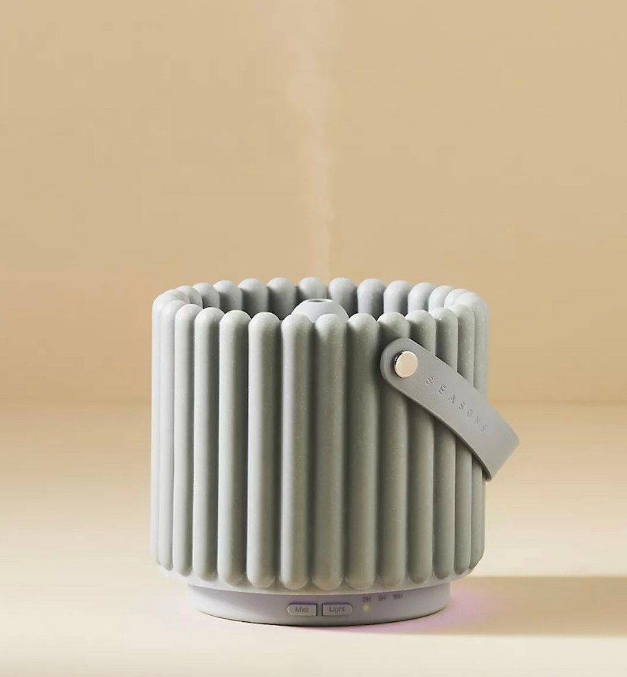 light sage blue seasons diffuser on beige surface