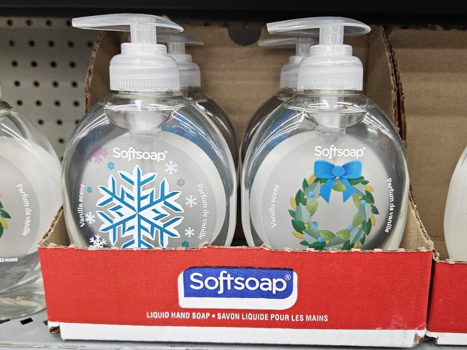 two christmas themed softsoap hand soap bottles on store shelf