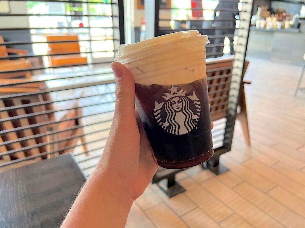 holding Starbucks cold foam holiday drink 