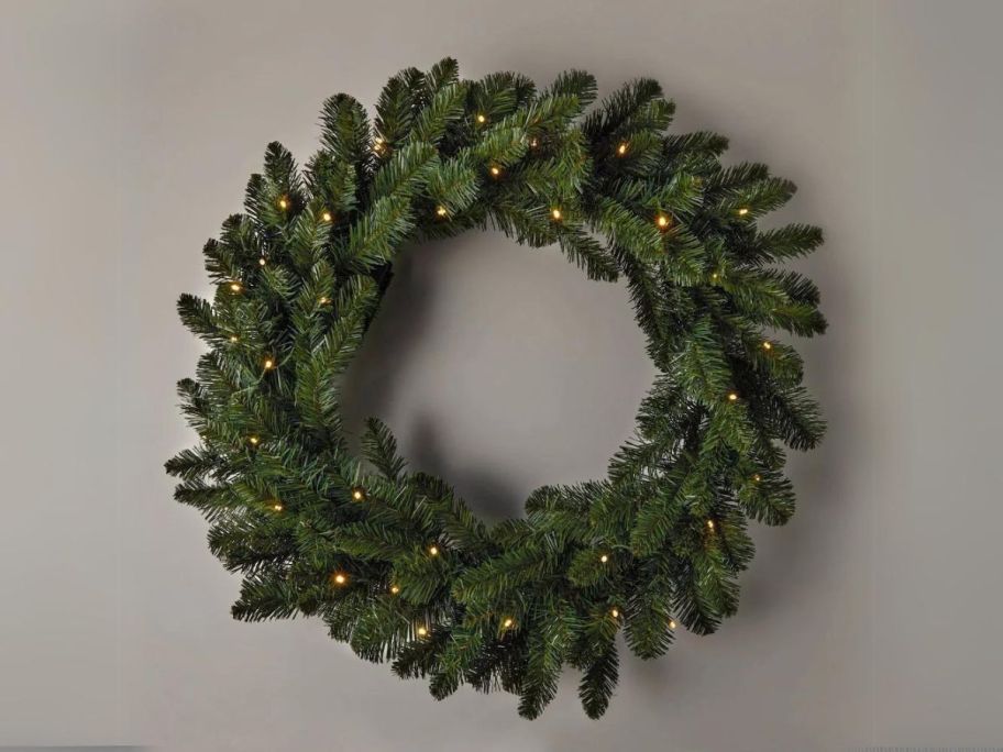 Wondershop 28" Pre-Lit Battery Operated Artificial Christmas Wreath on wall