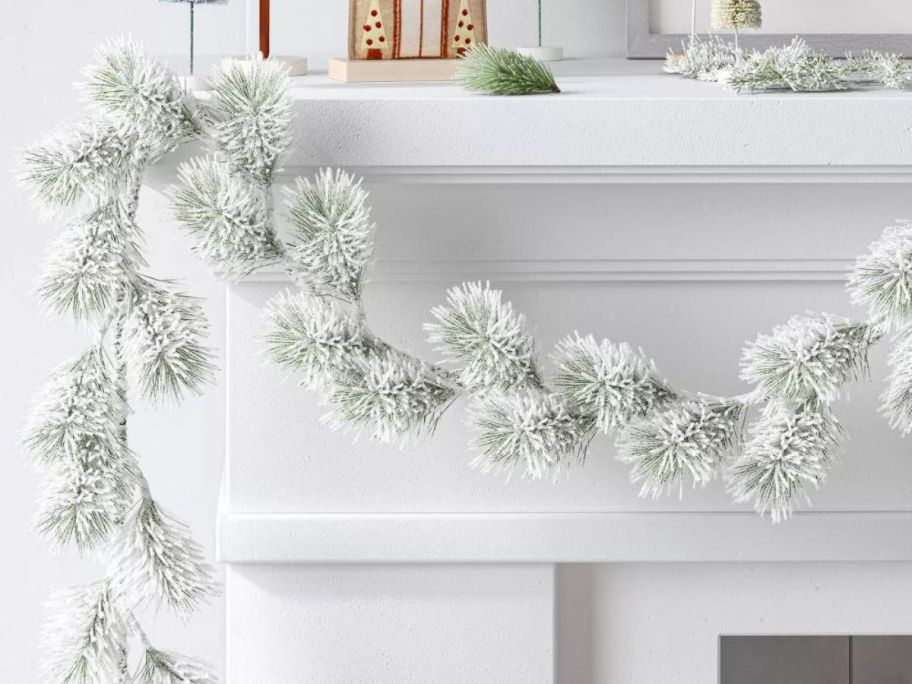 Wondershop 5' Flocked Greenery Christmas Artificial Garland on mantle