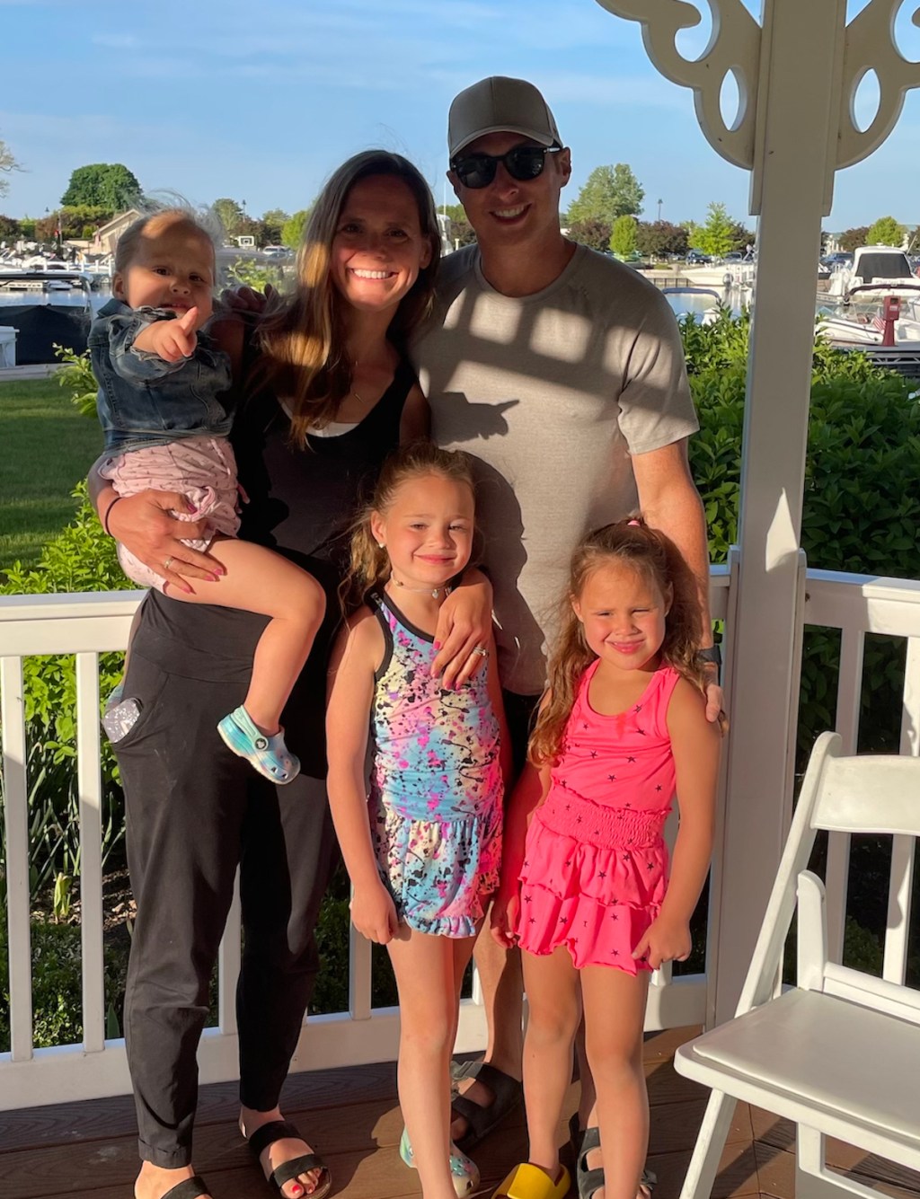 family standing inside gazebo 