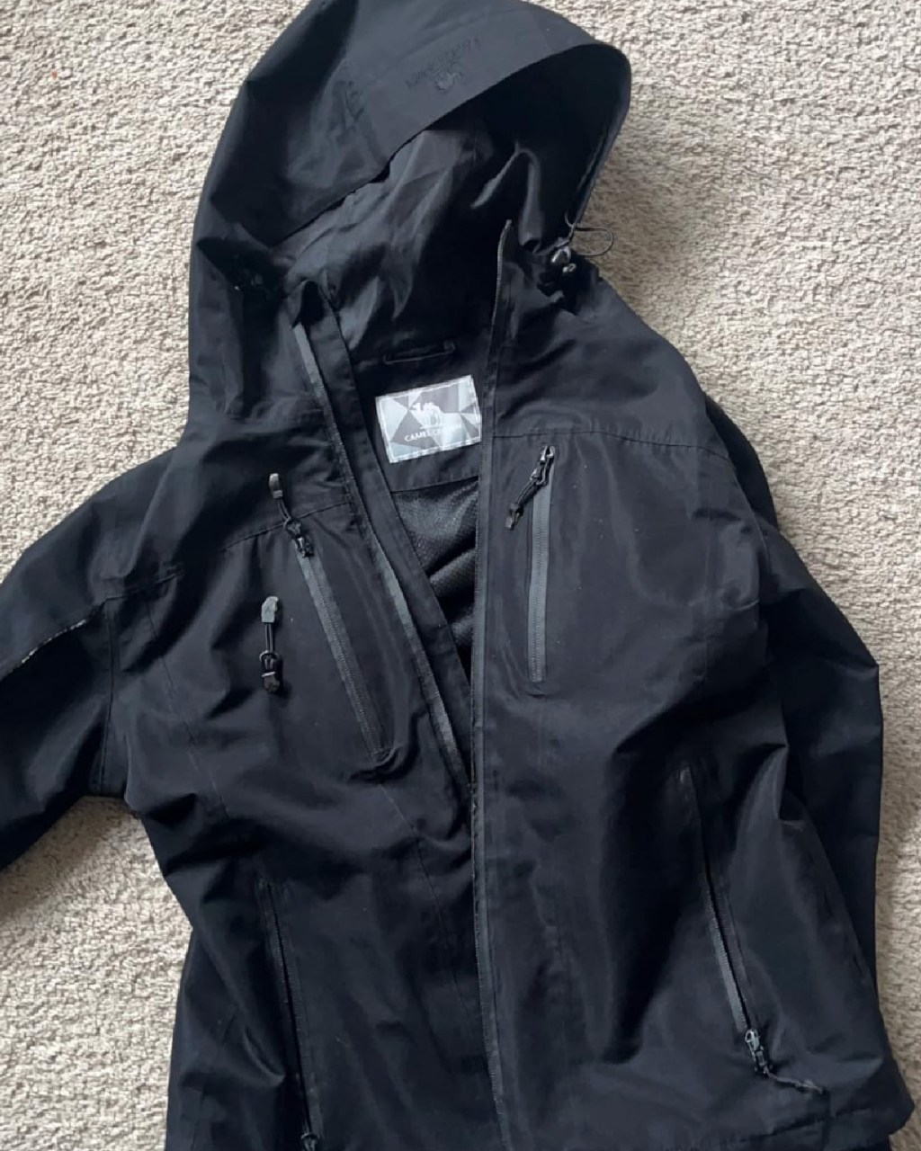 black waterproof jacket on floor