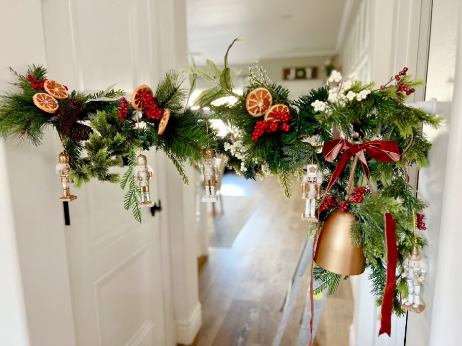 decorating a tension rod with a diy christmas garland