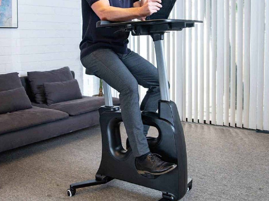 exercise bike in white with laptop on it-2