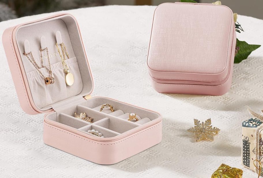 pink jewelry cases on table