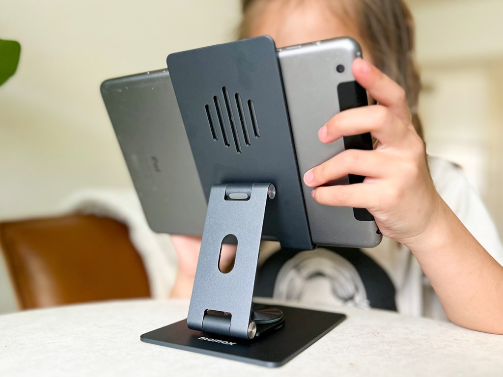 girl playing with ipad on stand