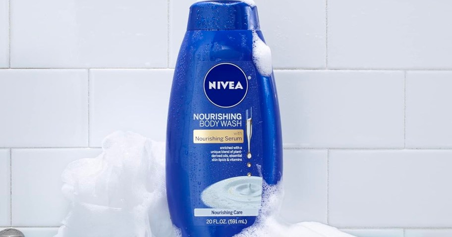 blue bottle of Nivea Nourishing Body Wash sitting in a shower