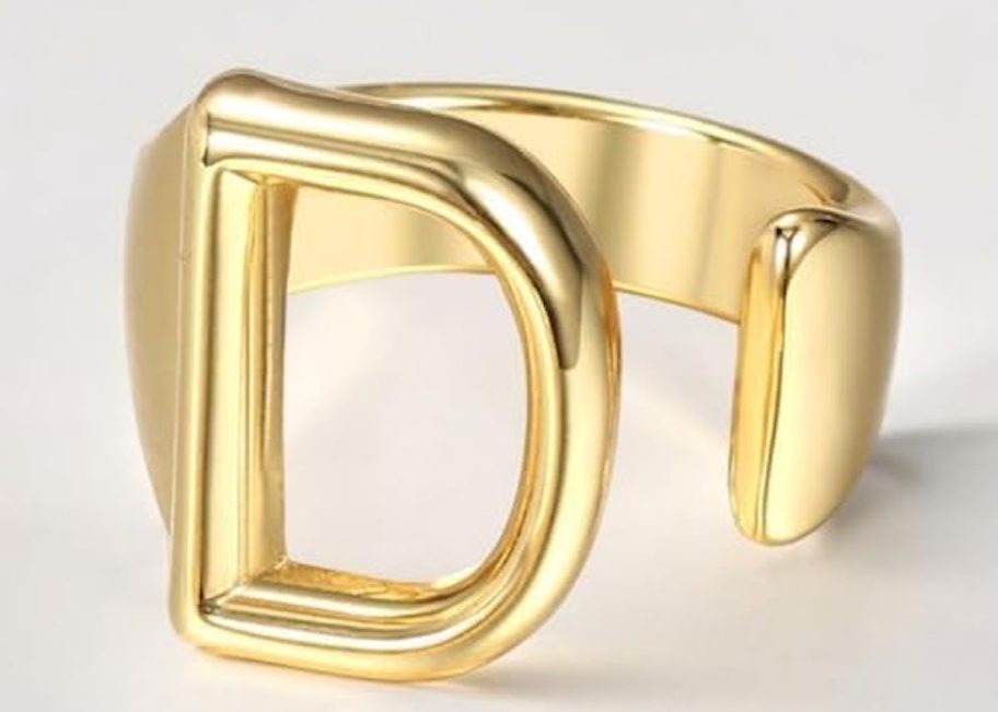 stock photo of gold d initial ring