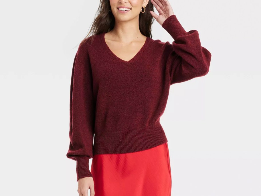 woman wearing maroon sweater 