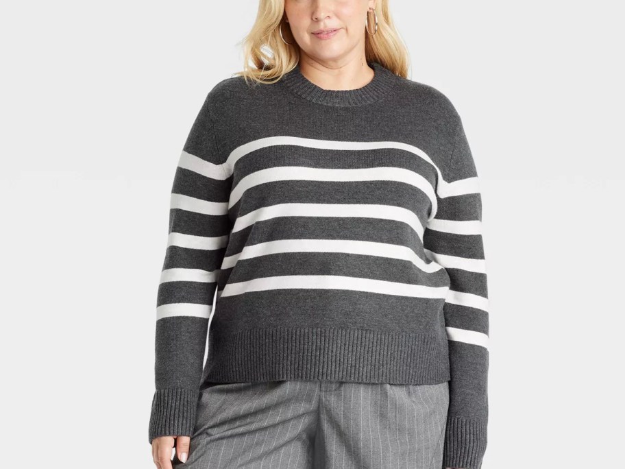 woman wearing gray and white striped sweater 