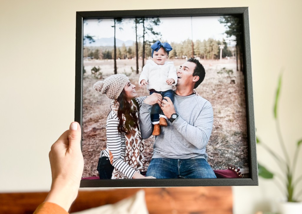 hand holding black wood tilepix frame