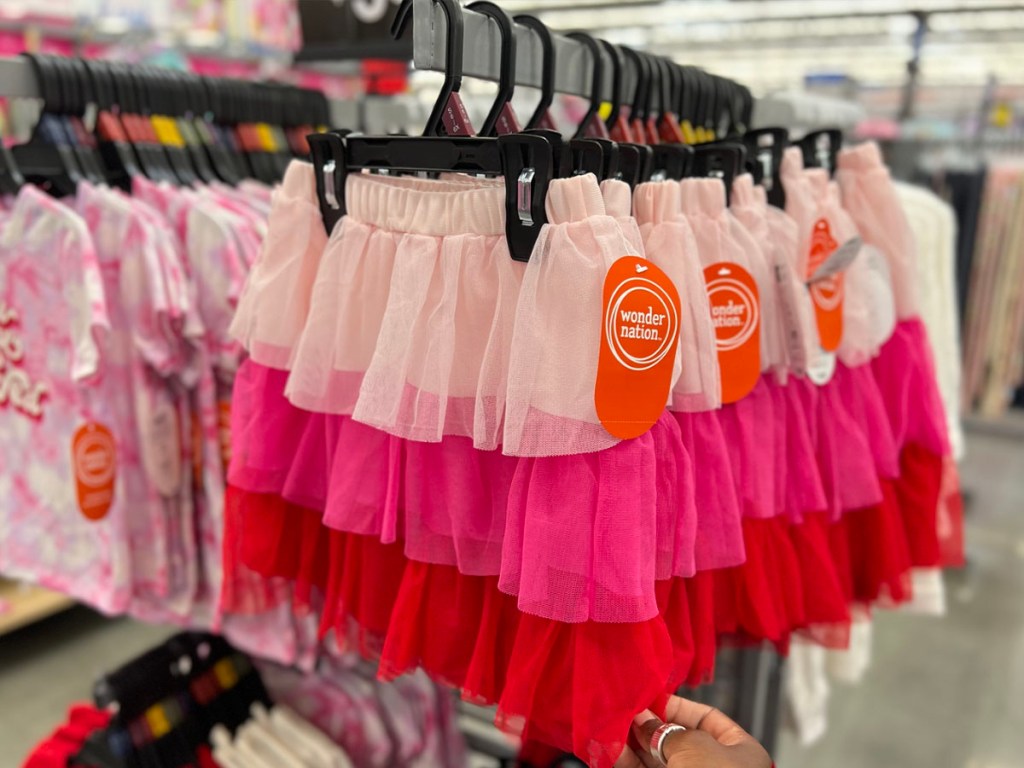 pink and red valentines day skirts hanging in store