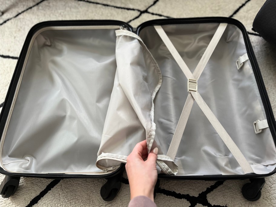 inside of carry on suitcase with beige liner