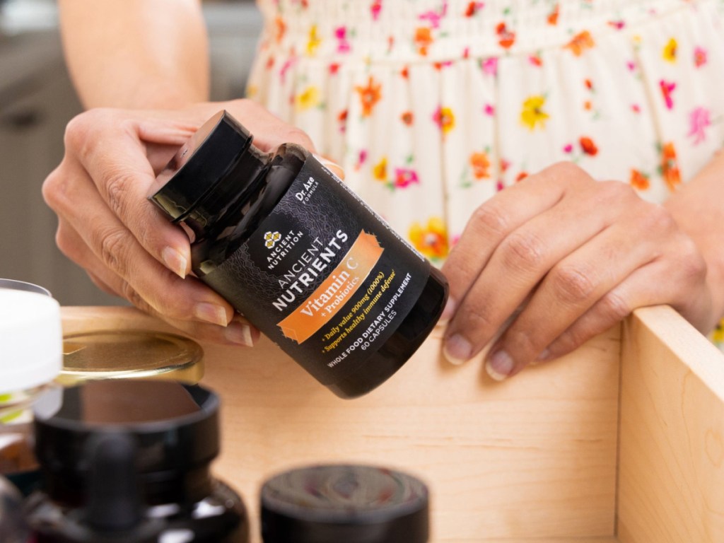 woman holding ancient nutrients vitamin c in her hands